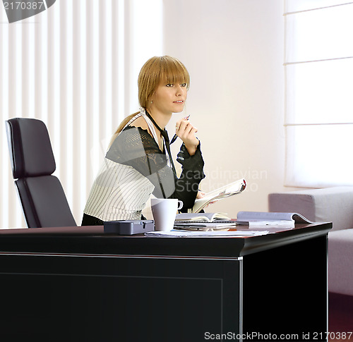 Image of businesswoman in her office