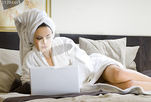 Image of woman in white bathrobe