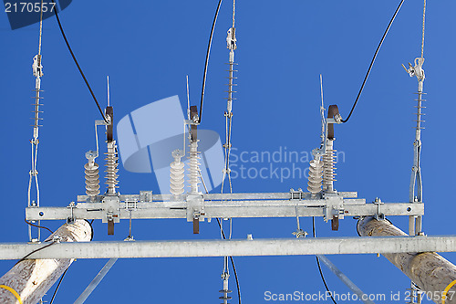 Image of Electricity disconnector,insulators on a blue sky background