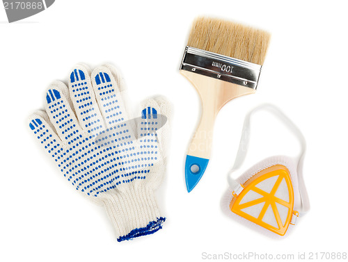 Image of pair of cotton gloves, paint brush and a dust mask