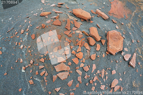 Image of rusty rocks in the sand