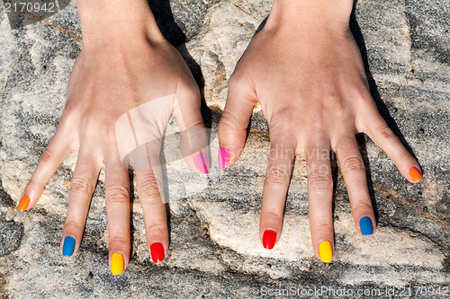 Image of Two female hand with the fashionable color nail polish