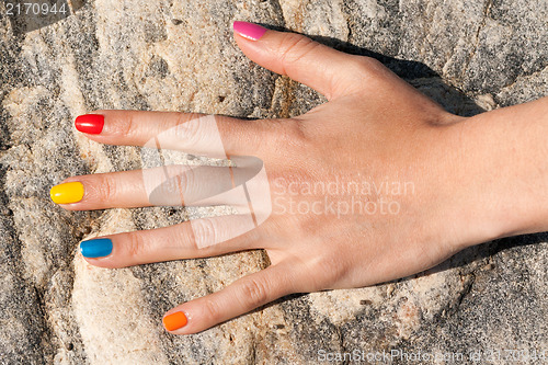 Image of Female hand with colorful trendy manicure