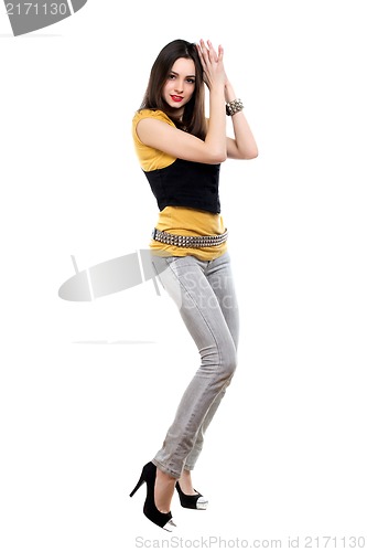 Image of Woman posing in grey jeans