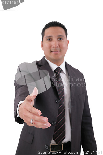 Image of A business man with an open hand ready to seal a deal. Focus in 