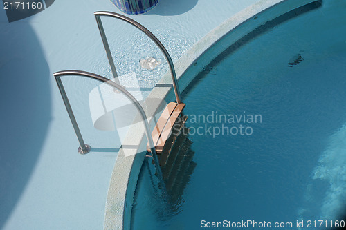 Image of Pool ladder and swimming pool 