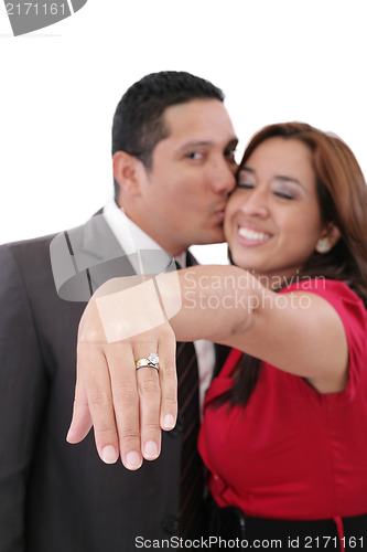 Image of Young beautiful woman showing her engagement ring 