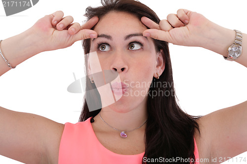 Image of Portrait of a funny young woman looking up on isolated backgroun