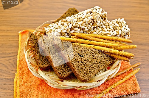 Image of Rye bread and crispbreads in a wicker plate on napkin