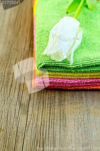 Image of Towels stack with white tulips