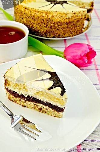 Image of Cake with pink tulips on the tablecloth