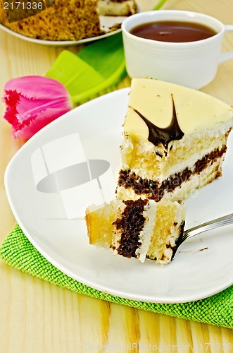 Image of Cake with pink tulips on a wooden board