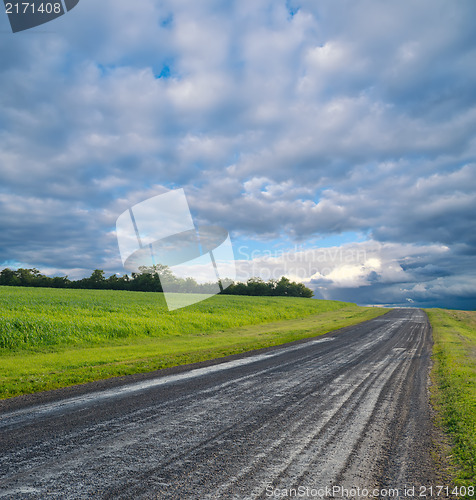 Image of rural road and stormy clouds