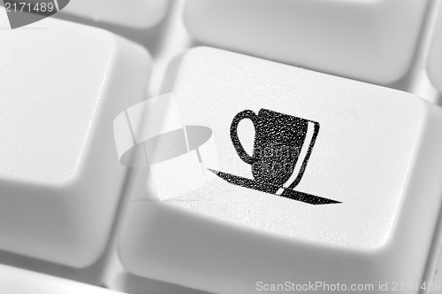 Image of The button with an emblem of a cup of coffee on the keyboard. A 