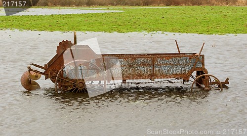 Image of Flooded Antique Farming Equipment