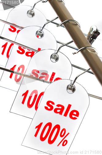 Image of Sale. A hanger with labels on a white background.