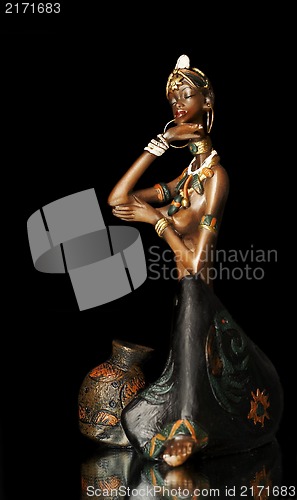 Image of  Figurine of the African girl on a black background