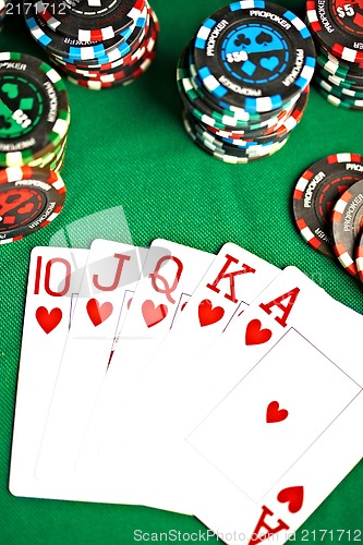 Image of man with a beard plays poker