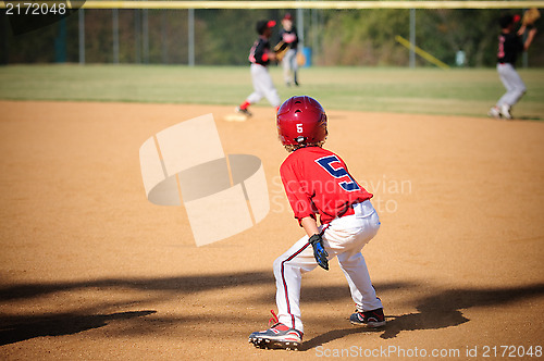 Image of Little league baseball player trying to steal