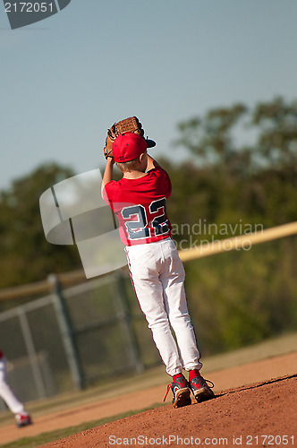 Image of Youth pitcher checking second base