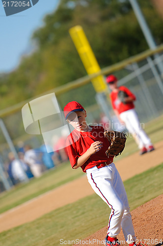 Image of Little league pitcher looking at third
