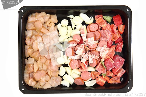 Image of raw chicken meat with vegetable