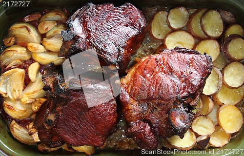 Image of roasted pork knuckle with potatoes