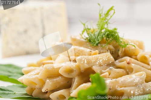 Image of Italian pasta penne gorgonzola and pine nuts