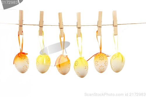 Image of hanged bright color easter eggs with bows