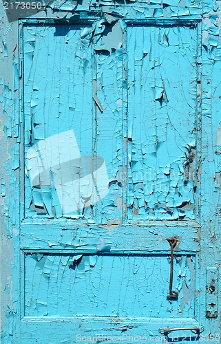 Image of cracked old painted blue door