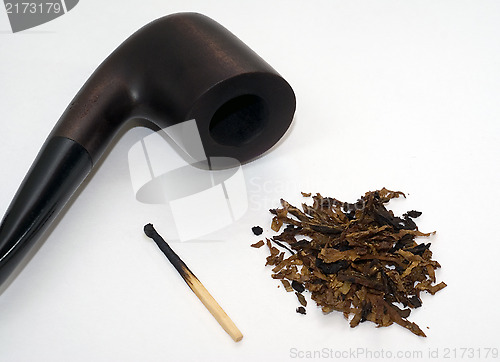 Image of Pipe, tobacco and burnt match. 