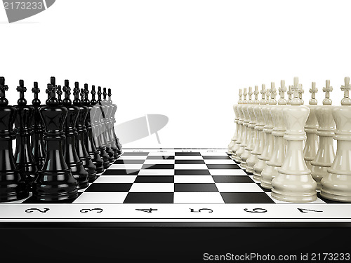 Image of Black and white chess kings stand in a row opposite to each other on a chessboard