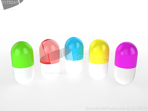 Image of different colors capsules stand in a row