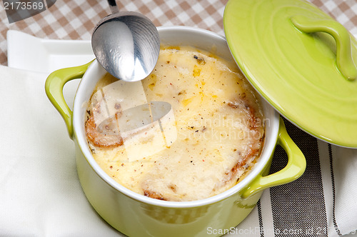 Image of onion soup with melted cheese and bread on top