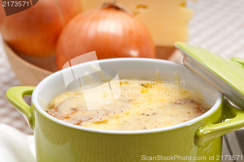 Image of onion soup with melted cheese and bread on top