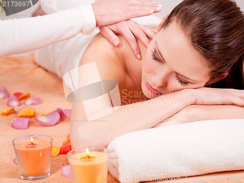 Image of young attractive smilig woman doing wellness spa