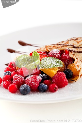 Image of fresh tasty homemade crepe pancake and fruits