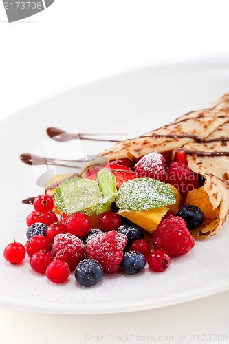 Image of fresh tasty homemade crepe pancake and fruits