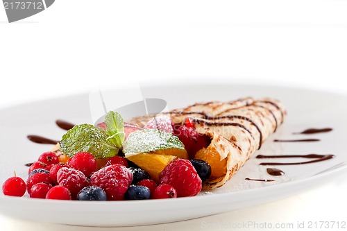 Image of fresh tasty homemade crepe pancake and fruits