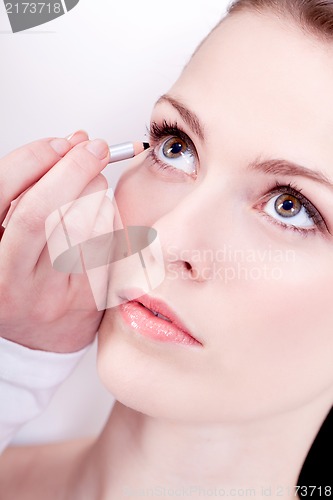 Image of at the cosmetic studio eyeliner on eyes make up