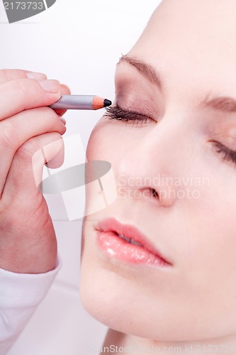 Image of at the cosmetic studio eyeliner on eyes make up