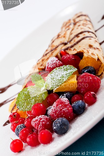 Image of fresh tasty homemade crepe pancake and fruits