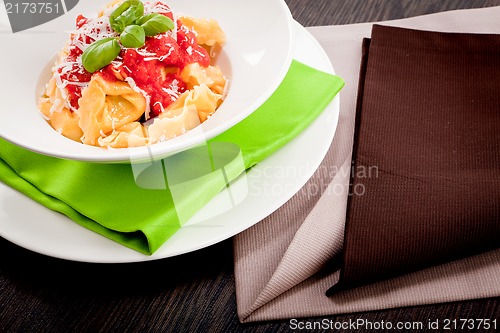 Image of tasty fresh homemade ravioli and tomato sauce