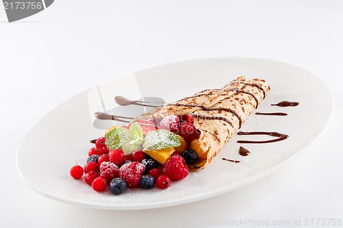 Image of fresh tasty homemade crepe pancake and fruits