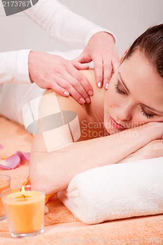 Image of young attractive smilig woman doing wellness spa