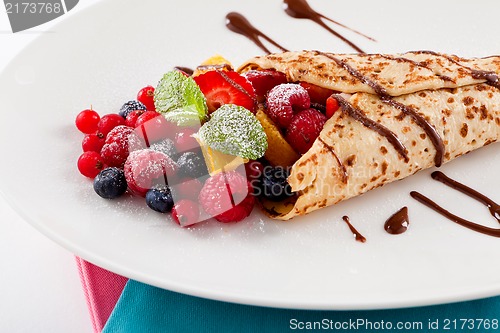 Image of fresh tasty homemade crepe pancake and fruits