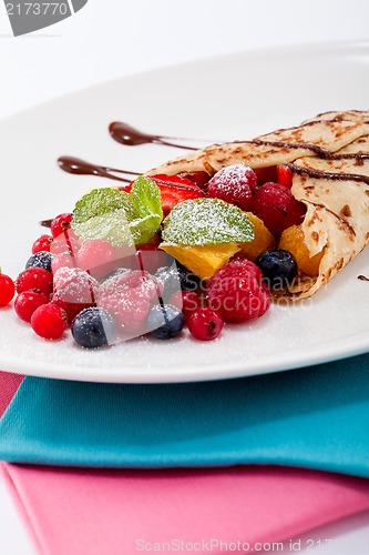 Image of fresh tasty homemade crepe pancake and fruits