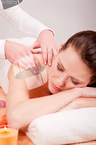 Image of young attractive smilig woman doing wellness spa