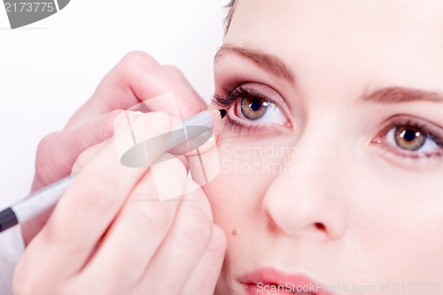 Image of at the cosmetic studio eyeliner on eyes make up