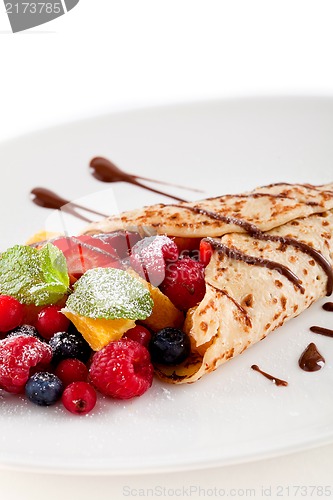 Image of fresh tasty homemade crepe pancake and fruits